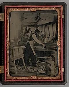 Untitled (Carpenter in his Workshop) by Unknown