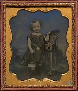 Boy with hobby horse by Unknown Artist