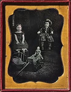 Two Children with Toys by Unidentified Photographer