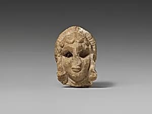 Female head with elaborate hairstyle by Unknown Artist