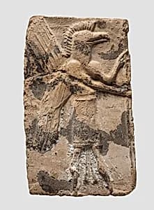 Molded plaque: eagle-headed apkallu by Unknown Artist