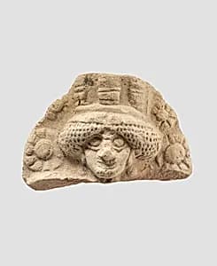Molded plaque: female head by Unknown Artist
