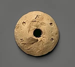 Spindle whorl by Unknown Artist