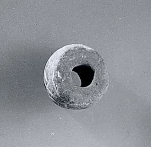 Spindle whorl by Unknown Artist