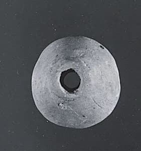 Spindle whorl by Unknown Artist