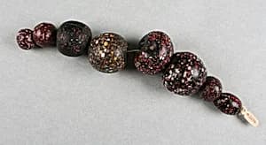 Beads, string of eight by Unknown Artist