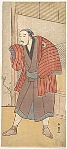 Onoe Matsusuke as a Servant Standing Beside a House by Katsukawa Shun'ei 勝川春英