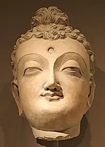 Head of a Buddha by Unknown Artist