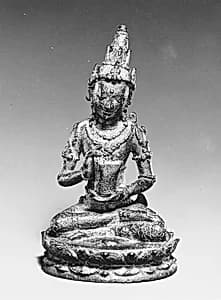 Seated Male Deity Holding a Cuirass (Chest Armour) by Unknown Artist