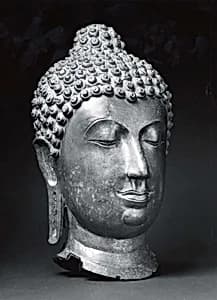 Head of Buddha by Unknown Artist