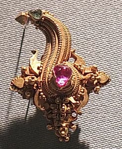 Earclip with Conch Motif and Inlaid Stones by Unknown Artist