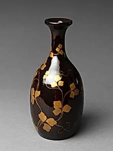 Sake bottle with grapevine decoration by Unknown Artist