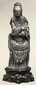 Seated Figure of Guanyin on Rock Base with Carved Armrest by Unknown Artist
