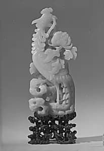 Figure of a Phoenix Standing amid Carved Foliage with Peony Motifs by Unknown Artist