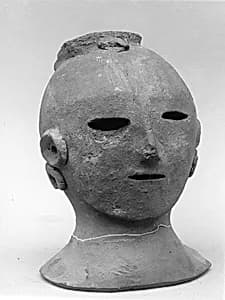 Head of a Female Haniwa Figure with Headdress and Earrings by Unknown Artist