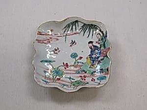 Dish with figures by a lotus pond by Unknown Artist