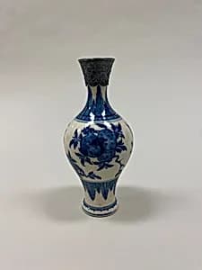 Vase with peaches, pomegranates, and fingered citrons by Unknown Artist