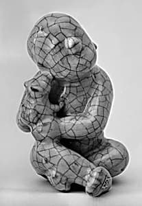 Figure of a seated boy by Unknown Artist
