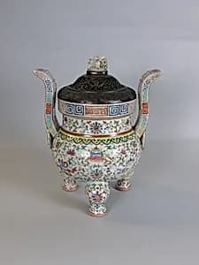 Tripod incense burner with Buddhist auspicious symbols by Unknown Artist