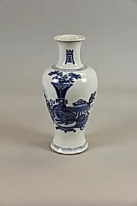 Vase with a display of antiques by Unknown Artist