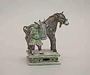 Figure of a donkey and attendent by Unknown Artist