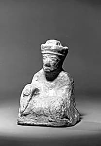 Miniature figure of a seated man by Unknown Artist