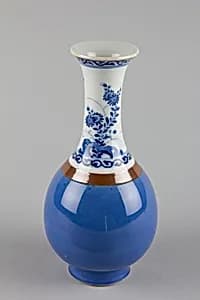 Vase with flowers and rocks by Unknown Artist