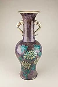 Vase with elephant head handles and floral decoration by Unknown Artist