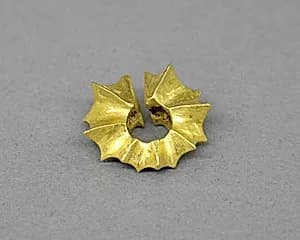 Ear Clip in the Shape of a Starfruit by Unknown Artist