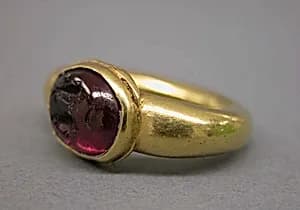 Ring with Dark Red Inset Oval-Shaped Stone by Unknown Artist