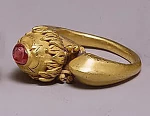 Stirrup-Shaped Ring with Red Stone in Circular Mount by Unknown Artist