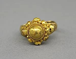 Ring with Large Central Boss Flanked by Series of Same by Unknown Artist