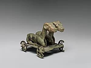 Two Rams on Wheeled Cart by Unknown Artist