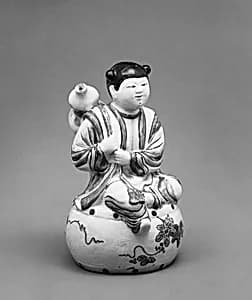 Water Dropper in the Shape of a Youth Seated on a Drum and Holding a Gourd on His Back by Unknown Artist