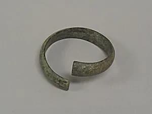One from a Pair of Undecorated Torqued Anklets by Unknown Artist