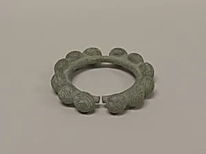 One from a Pair of Bangles with Ball Decorations by Unknown Artist