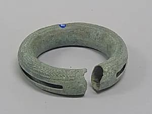 Hollow Bangle with Pellets and Decoration by Unknown Artist