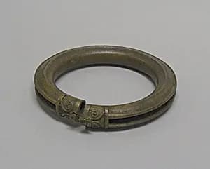 Hollow Anklet with Pellets and Decorated Ends by Unknown Artist