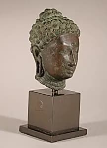 Head of a Buddha by Unknown Artist