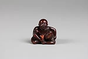 Netsuke of a Man Holding a Mermaid by Unknown Artist