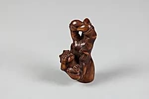 Netsuke of Ōni (Demon) Weeping Beside Giant Arm of Demon by Unknown Artist