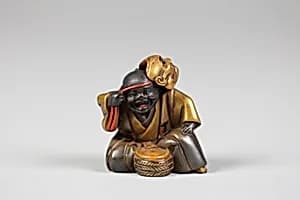 Netsuke of Boy with a Mask by Unknown Artist