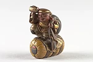 Netsuke of Daikoku and Bag on Rice Bale by Unknown Artist