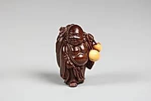 Netsuke of Hotei with Bag and Gourd by Unknown Artist