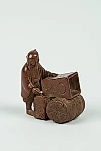 Netsuke of Artist Marking a Box by Unknown Artist