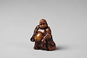 Netsuke of Hotei and Bag with Fan by Unknown Artist