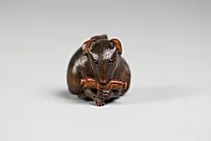 Netsuke of Mouse with Scroll in Mouth by Unknown Artist