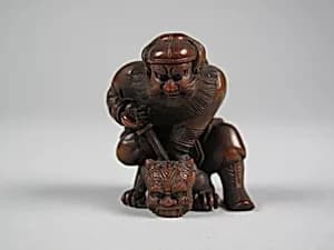 Figure of a Man Killing a Demon by Unknown Artist