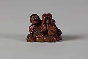 Netsuke of Tokutaro and Fox Disguised as a Woman by Unknown Artist
