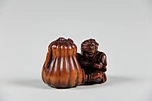 Netsuke of Boy Cutting a Gourd by Unknown Artist